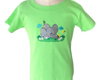 Boys or girls green tee shirt with a cute elephant enjoying the flowers.