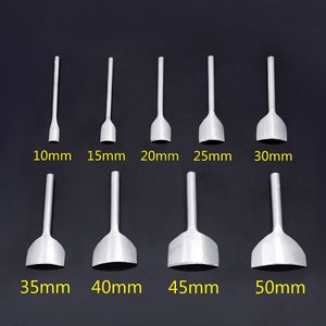 May include: A collection of eight silver leathercraft tools, with sizes from 10mm to 50mm. Each tool features a flat, rounded cutting edge and a long handle. The sizes are clearly marked in millimetres.