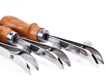 May include: Three leather stitching tools with wooden handles and adjustable metal arms. The tools are used for creating even stitches in leather goods.