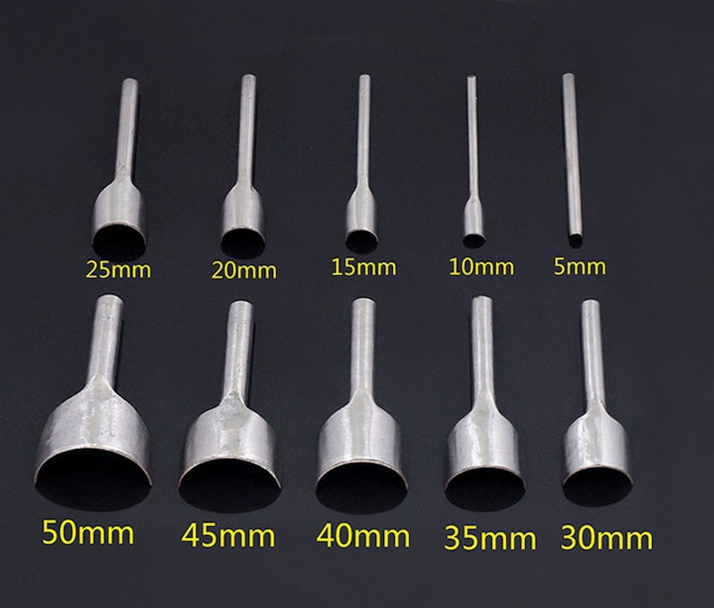 May include: Set of 10 leather hole punch tools in various sizes, ranging from 5mm to 50mm. The tools are made of metal and have a silver finish.