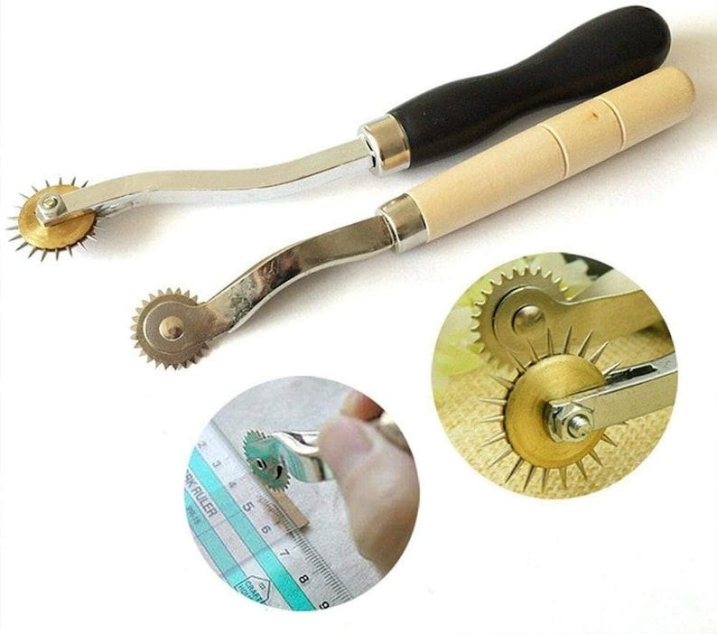 May include: Two sewing tools with wooden handles and metal wheels with sharp points. The wheels are designed to create holes in fabric for sewing.
