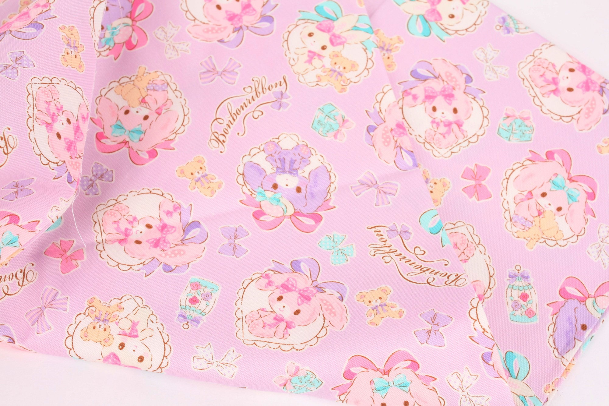 beige packed Sanrio character oxford fabric Fabric by Sanrio - modeS4u