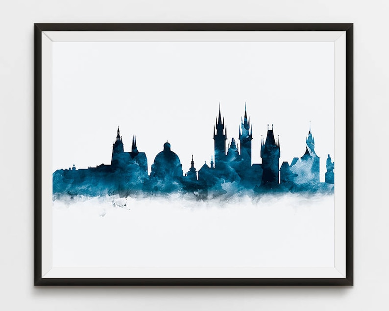 May include: A watercolor painting of the Prague skyline in shades of blue. The cityscape features several prominent buildings, including the iconic Prague Castle and the Charles Bridge.