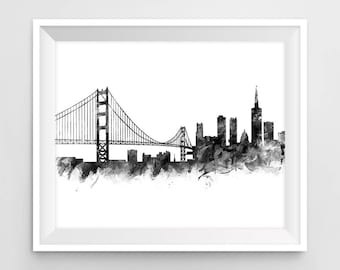 May include: Black and white watercolor illustration of the San Francisco skyline, featuring the Golden Gate Bridge and skyscrapers.