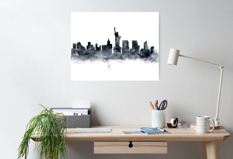 May include: A black and white watercolor illustration of the New York City skyline, featuring the Statue of Liberty and other iconic buildings.