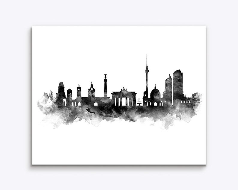 May include: Black and white watercolor illustration of the Berlin skyline, featuring iconic landmarks like the Brandenburg Gate, the Berlin TV Tower, and the Reichstag building.