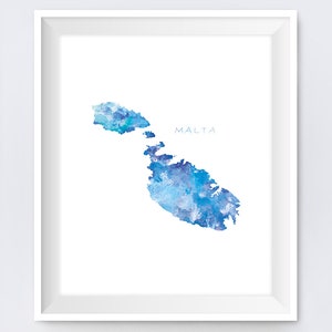 May include: A watercolor painting of the island of Malta in shades of blue. The word "MALTA" is written in white text at the top of the image.