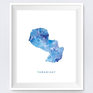 May include: A watercolor painting of the outline of Paraguay in shades of blue. The word "PARAGUAY" is written in blue below the map.