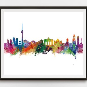 May include: A watercolor painting of the Berlin skyline, featuring the Brandenburg Gate, the TV Tower, and other iconic landmarks. The painting is done in a variety of colors, including blue, green, yellow, and red.