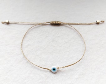 Gouden boze oog armband, witte boze oog armband, minimalistische sieraden, kleine oog armband, stapelbare mati armband, sierlijk boze oog