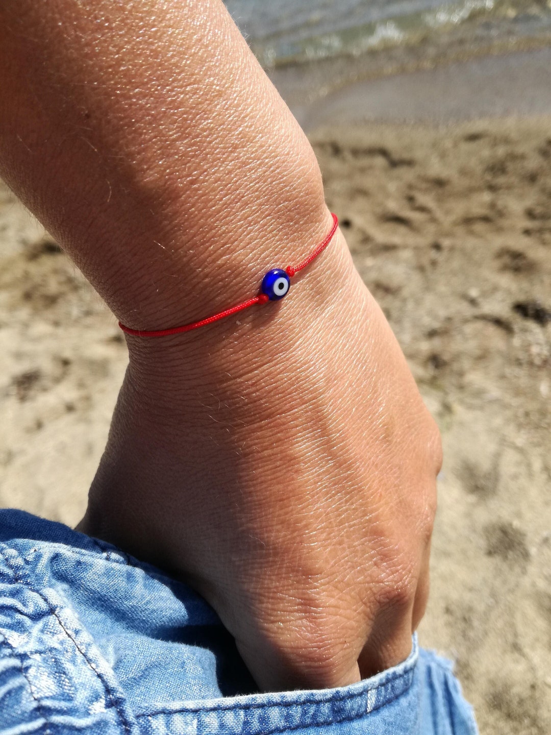 blue eye red bracelet