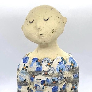Unique ceramic sculpture, whimsical ornament, art doll, decorative ceramic doll, red sculpture, quirky ceramic figure, cute art doll.