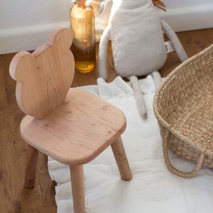 Wooden chair with bear shaped backrest. Natural color, rounded corners, soft to touch. Sturdy and stable chair.