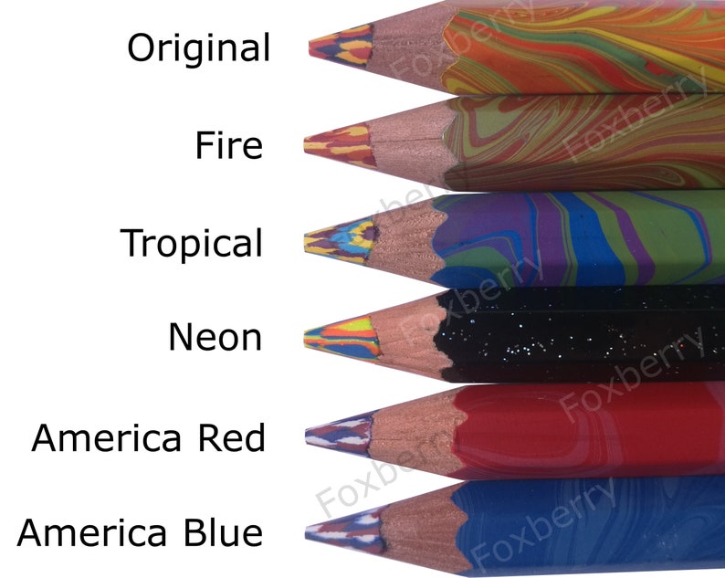 May include: Six colorful pencils with marbled wood casings. The pencils are labeled "Original", "Fire", "Tropical", "Neon", "America Red", and "America Blue".