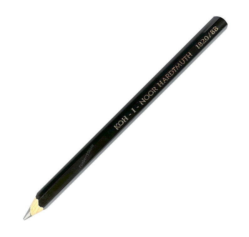 May include: A black pencil with gold lettering that reads "KOH-I-NOOR HARDTMUTH 1820/8B".