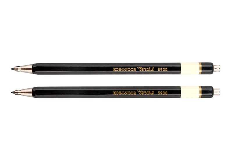 May include: Two black mechanical pencils with gold lettering that reads "KOH-I-NOOR Versatil 6900".