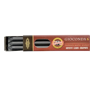 May include: A box of six black Gioconda 6 artist's leads, graphite pencils. The box is brown with gold lettering and a red label with the brand name "Gioconda" and the text "Authentic quality product - Artists' Leads - Graphite".