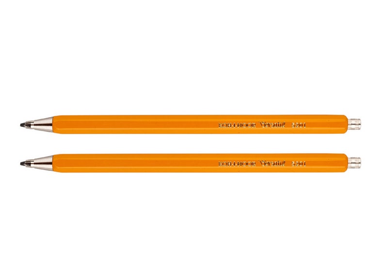 May include: Two orange mechanical pencils with the text "Faber-Castell Grip 2001" printed on the side.