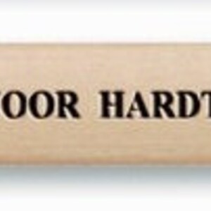 May include: A wooden pencil with a black graphite lead. The pencil is labelled "KOH-I-NOOR HARDTMUTH &bull; SKETCHING PENCIL &bull; 1538/4B".