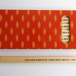 May include: A box of Koh-I-Noor Hardtmuth sketching pencils in a red and gold patterned box. The pencils are labelled "G PENCIL" and "PENCIL".