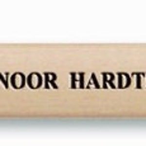 May include: A wooden pencil with a black graphite lead. The pencil is labelled "KOH-I-NOOR HARDTMUTH &bull; SKETCHING PENCIL &bull; 1538/2B".