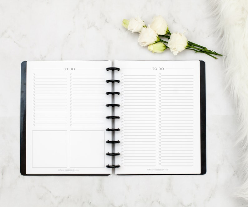 May include: A black and white to-do list planner with a black coil binding. The planner has two pages with lines and checkboxes for writing down tasks. The text "TO DO" is printed at the top of each page.