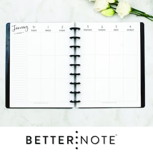 May include: A white monthly planner with a black cover and a black coil binding. The planner is open to January, with the days of the week labeled at the top of each column. The planner is on a white marble surface.