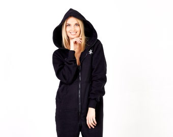 May include: A black hooded jumpsuit with a zipper closure. The jumpsuit has a logo on the chest.