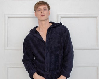 May include: A dark blue hooded robe with a tie belt and pockets.