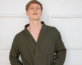 May include: A dark green robe with a long sleeve and a tie belt. The robe has a pocket on each side.