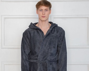 May include: A dark gray hooded robe with a tie belt and a pocket on the left side.