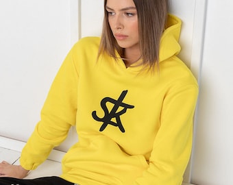 Sofa Killer warm yellow women hoodie with black SK logo