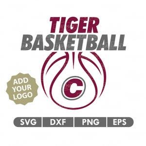 May include: A maroon basketball with a white outline and a white letter C in the center. The text "TIGER BASKETBALL" is above the basketball in gray letters. The text "ADD YOUR LOGO" is in a gold circle below the basketball. The text "SVG DXF PNG EPS" is below the logo in gray letters.