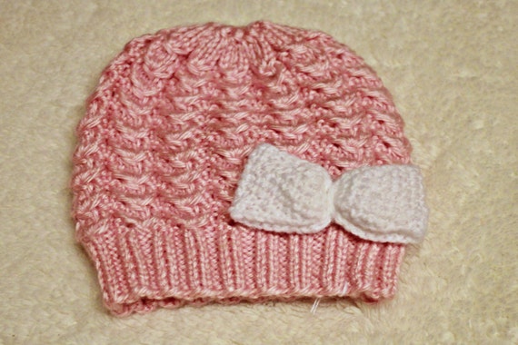 white knitted newborn hat