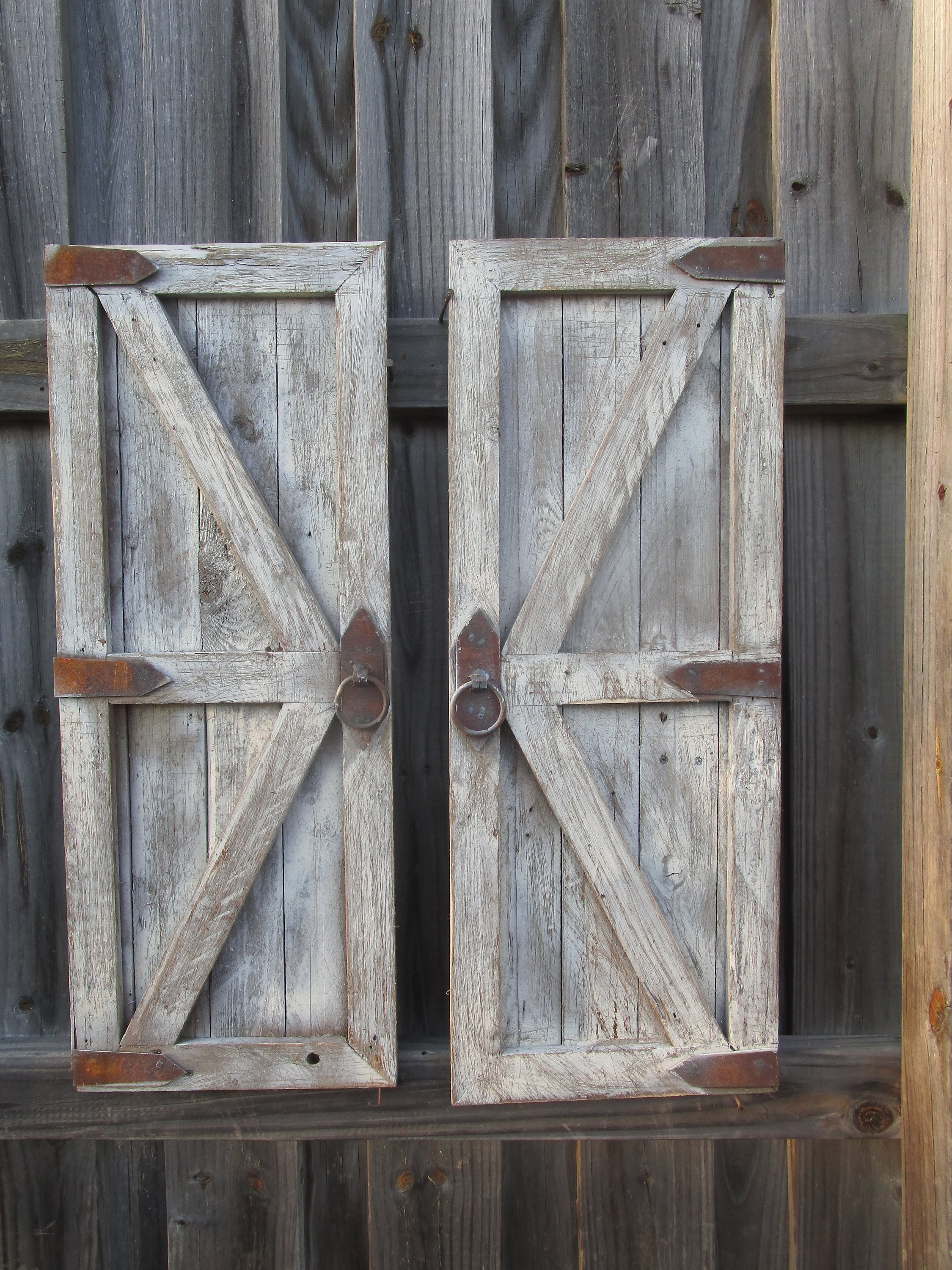 Pair of vintage inspired distressed cream- wood barn doors with