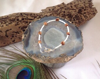 Pulsera de cuentas fantasma blancas