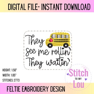 May include: A yellow school bus with a red apple on the side is featured on a white background with the text "They see me rollin' They waitin'" in black. The image is a digital embroidery design for a felt project, measuring 1.50 inches in height and 1.85 inches in width.