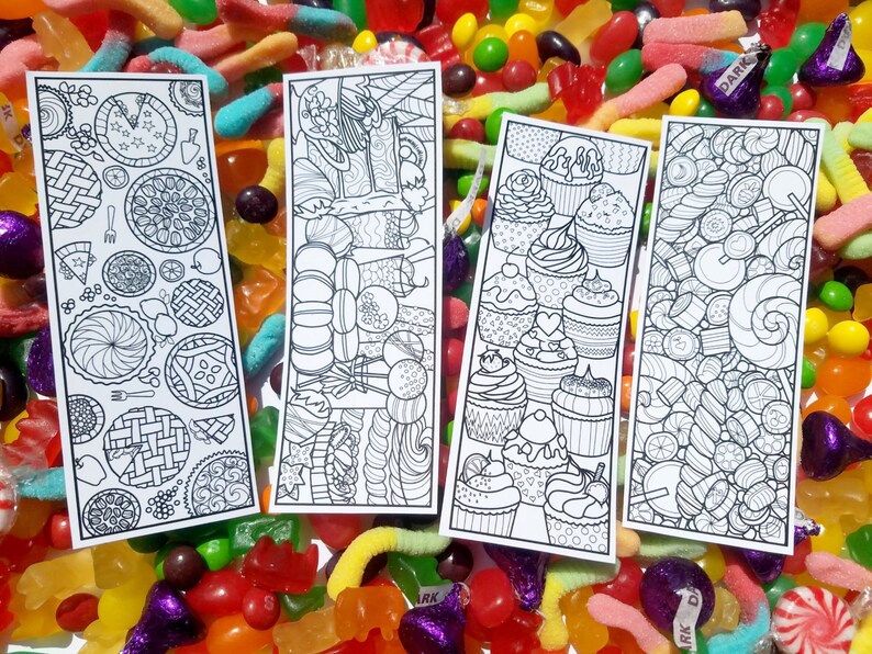 May include: Four black and white printable bookmarks with different designs. The designs include pies, cupcakes, and candy.