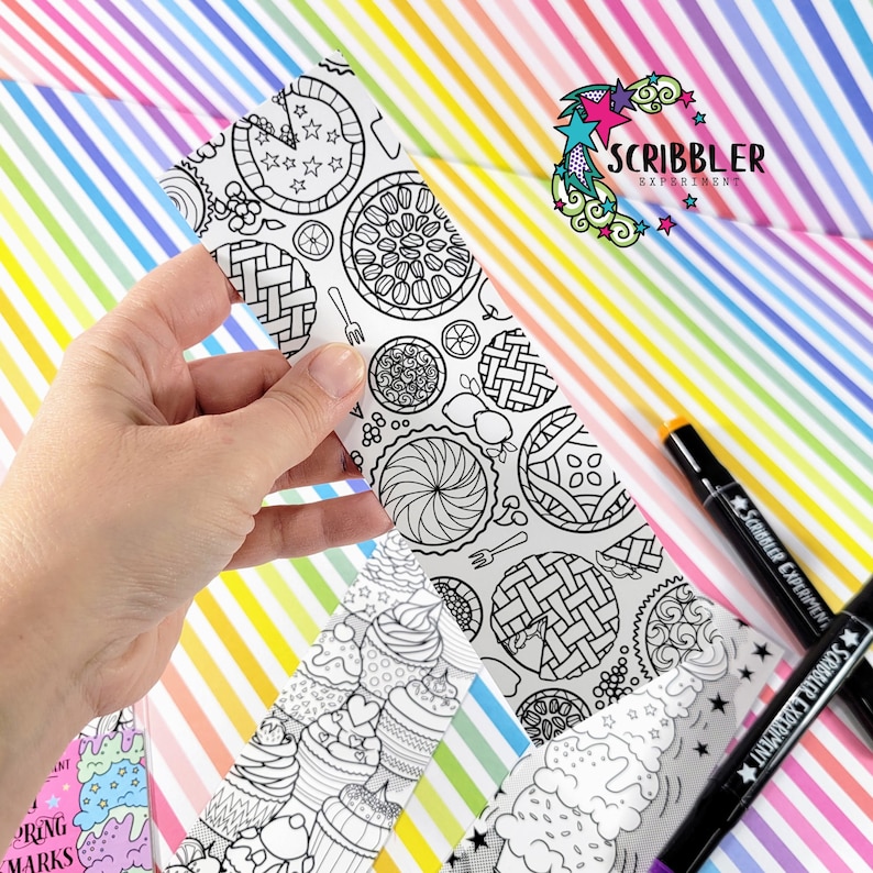 May include: A set of three black and white coloring bookmarks featuring different designs. The bookmarks are on a rainbow striped background. The text "SCRIBBLER EXPERIMENT" is visible on the top right corner of the image.