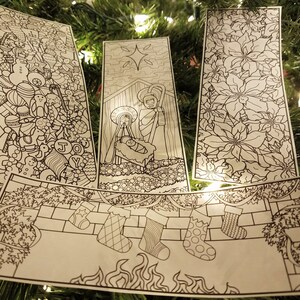 May include: Four black and white Christmas-themed coloring pages. The pages feature a nativity scene, a poinsettia flower, a stocking hanging on a brick wall, and a page filled with Christmas-themed doodles.