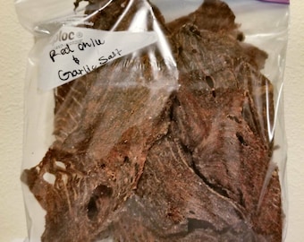 Beef Jerky!!! Red chile and garlic salt flavor. Tasty treat so yummy!! Great Gift!!