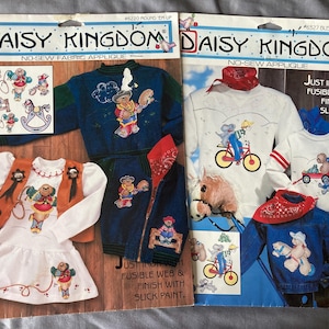 May include: Two packages of iron-on fabric appliques featuring a cowboy and bear theme. The packages are from Daisy Kingdom and include instructions to use fusible web and slick paint.