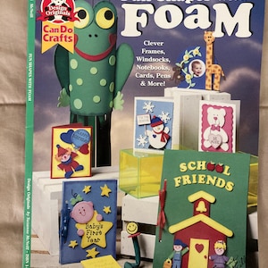 May include: A book cover with the title "Fun Shapes with Foam" and a green frog illustration. The book features craft projects for making frames, windsocks, notebooks, cards, and more.