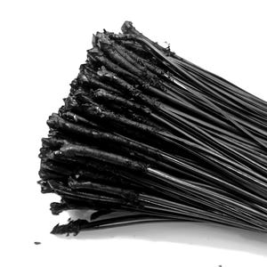May include: A dense bundle of thin, black, flexible plastic cable ties. Each tie features a smooth, elongated shaft and a textured, rectangular locking head at one end. The ties are grouped together, showing a uniform black color throughout.