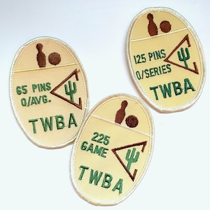 May include: Three embroidered patches with a beige background and a white border. Each patch features a bowling pin and ball, text, and a green and brown graphic. The text includes "65 PINS O/AVG.", "125 PINS O/SERIES", and "225 GAME".