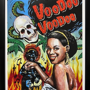 May include: A framed art print featuring a smiling person in the foreground, a dark-skinned figure with red hair, a skull, a green snake, and flames. The text Voodoo Voodoo is printed in red at the top. The artwork is signed and numbered 1/10 at the bottom.