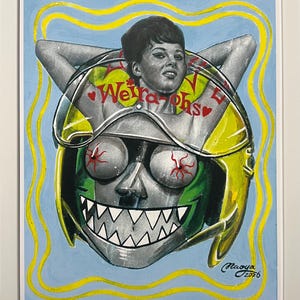 May include: Framed artwork featuring a woman's face and a robot-like head with a green and yellow helmet. The artwork includes the text "Weirdo Phs" and is set against a light blue background with yellow lines.