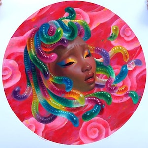 May include: A square art print featuring a portrait of a woman with colorful, serpentine hair. The artwork is set against a red background with pink roses. The print measures 23 inches by 23 inches.