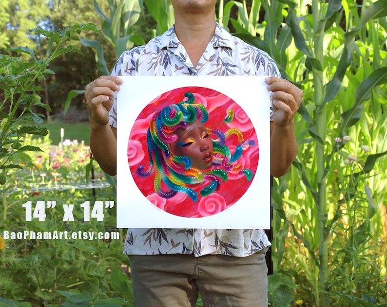 May include: A square art print, 14 x 14 inches, featuring a vibrant illustration of a face with colorful hair and a red background. The artwork has a circular design with the text "BaoPhamArt.etsy.com" at the bottom.