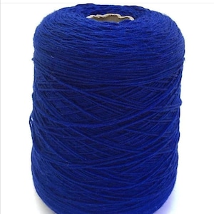 May include: A spool of bright blue yarn.